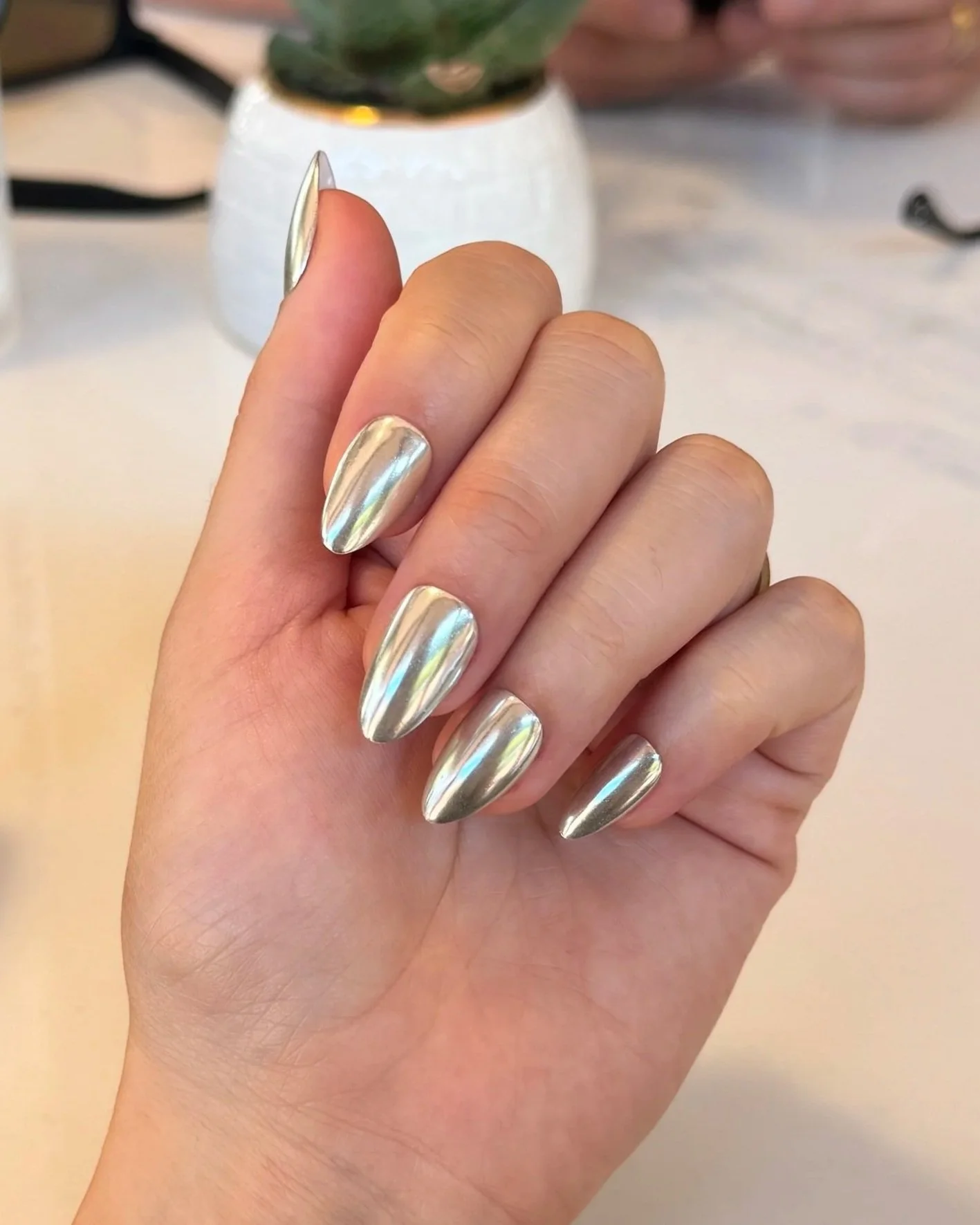 Silver chrome glaze on almond nails