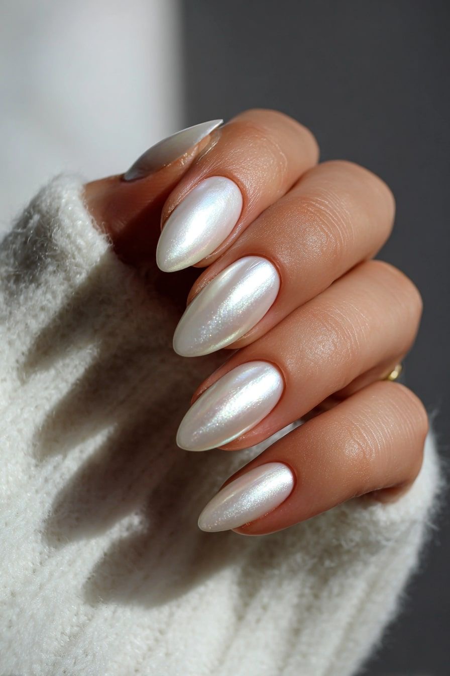 Long almond winter nails with pearl white chrome finish