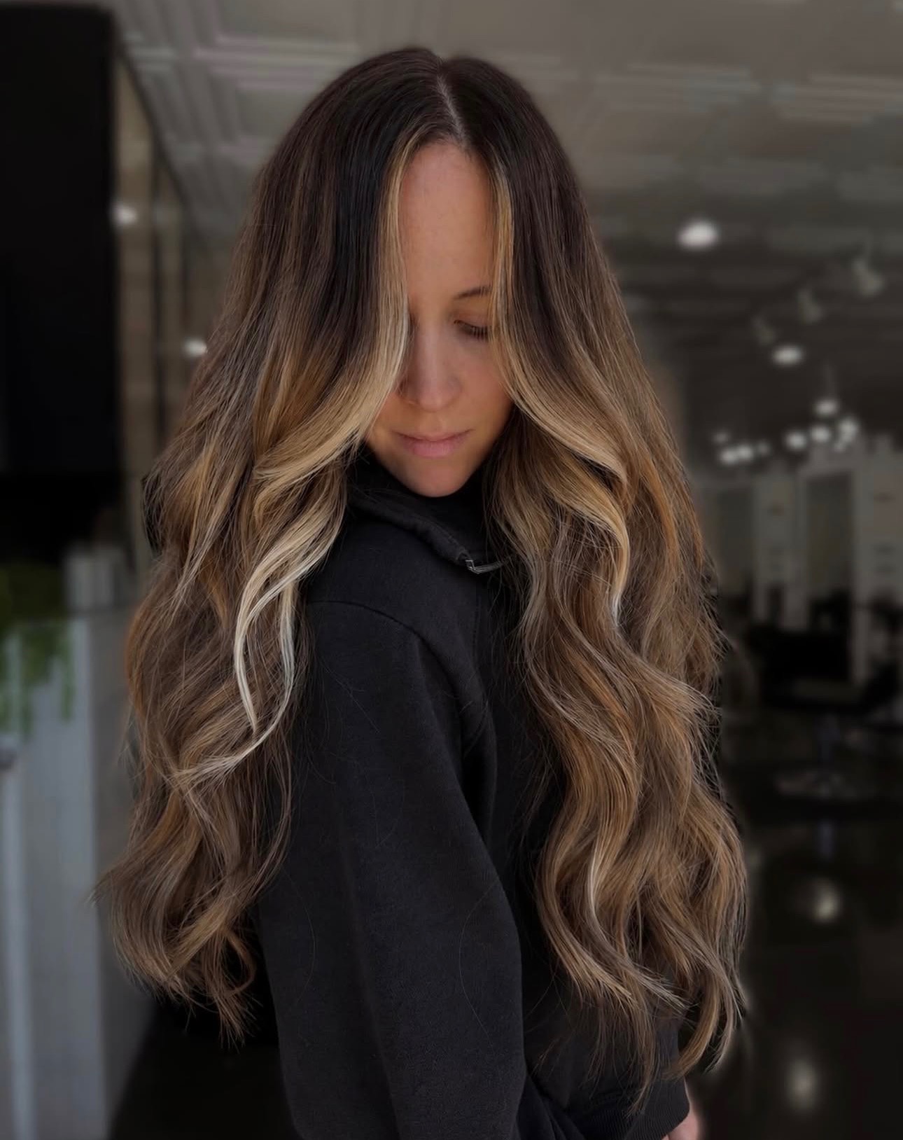 Honey face-framing highlights on brunette hair