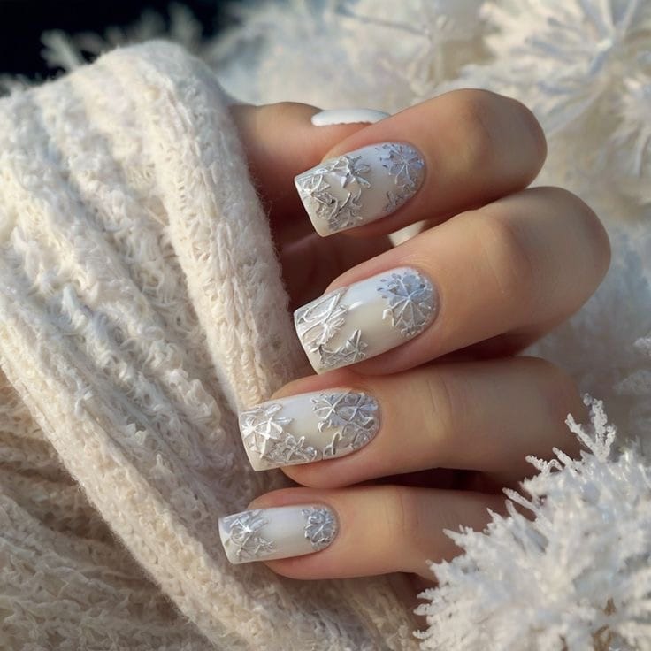 Milky white square nails with silver snowflake nail art