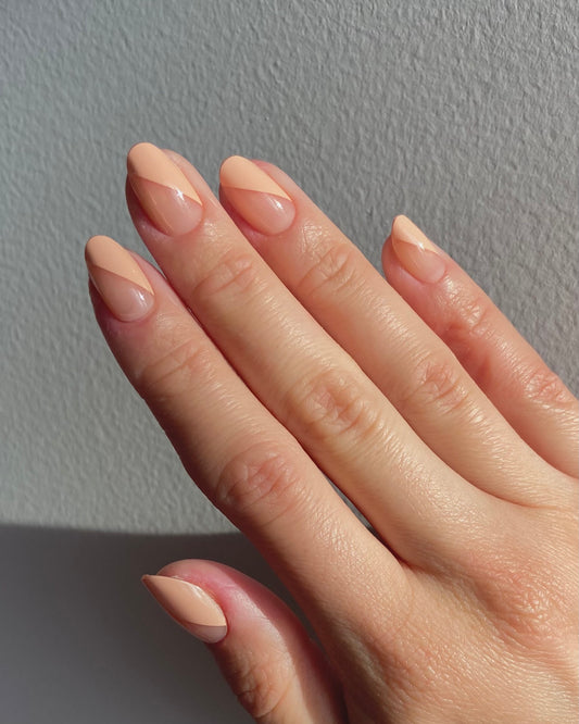 Short almond nails with a mauve negative-space design