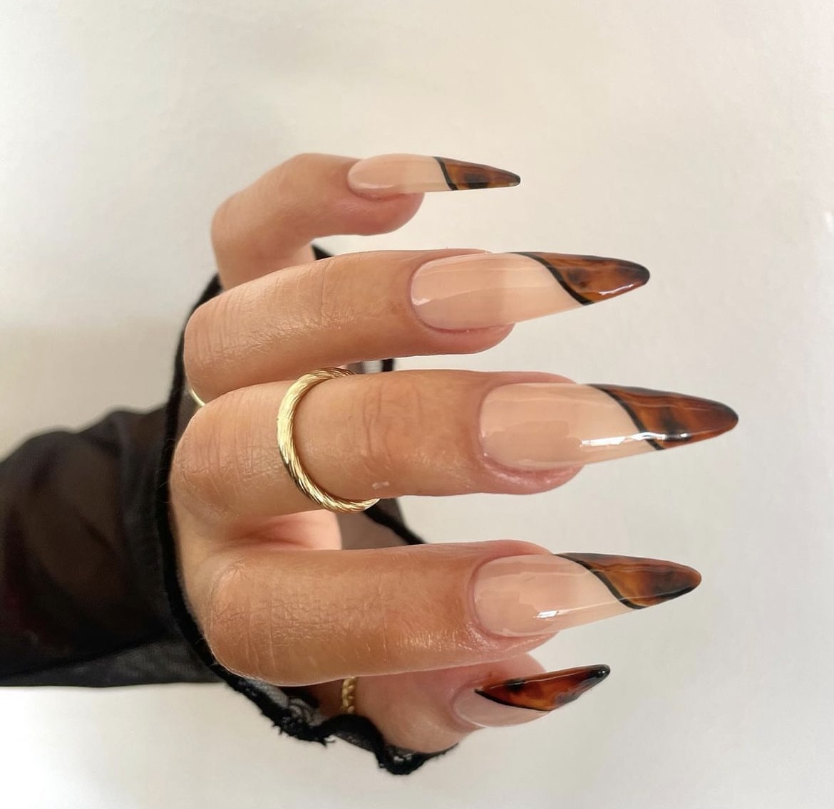 Nude stiletto nails with tortoiseshell french tips