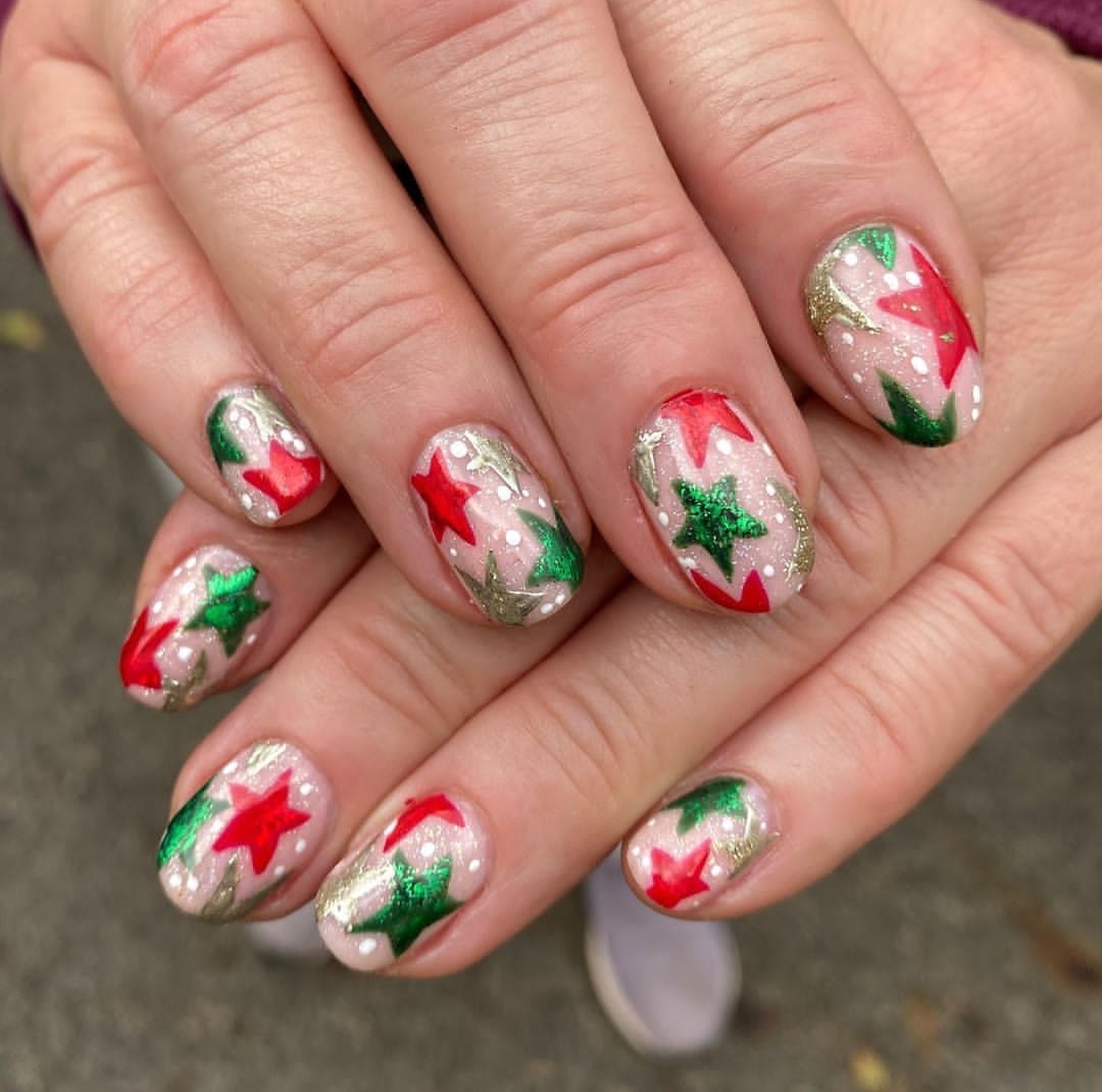Short sheer Christmas nails with red green and gold star art