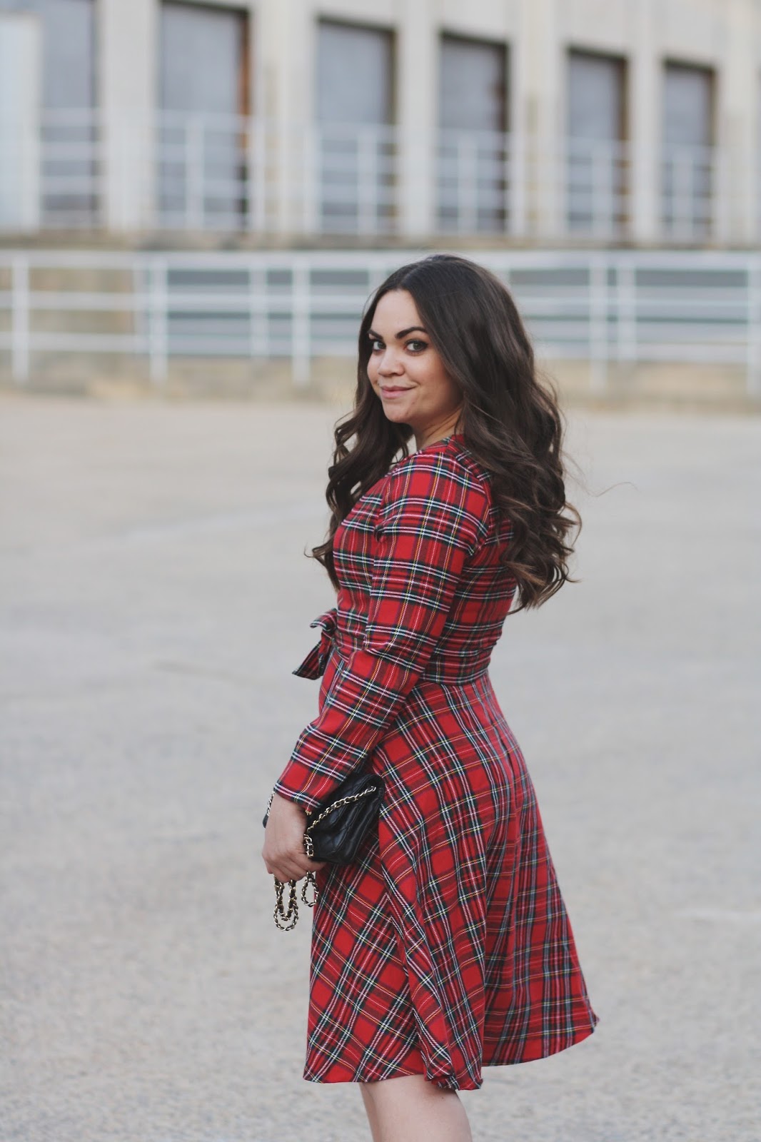 Woman in a red plaid dress, winter plaid outfit