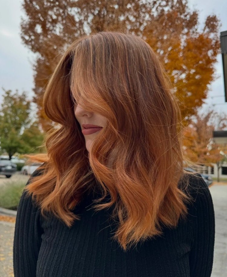 Salon-styled chestnut brown hair with a glossy blowout