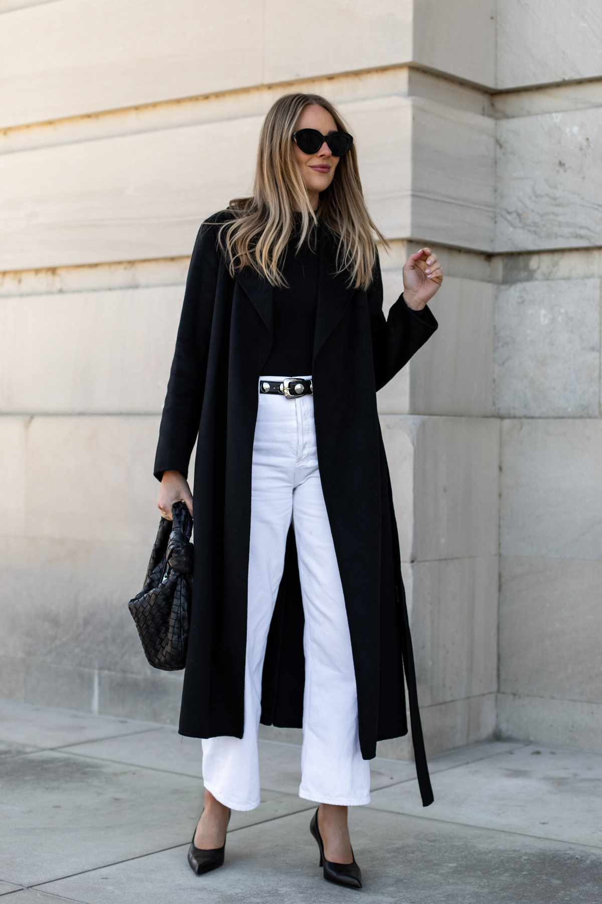 Black wool coat with white jeans, black top and heels