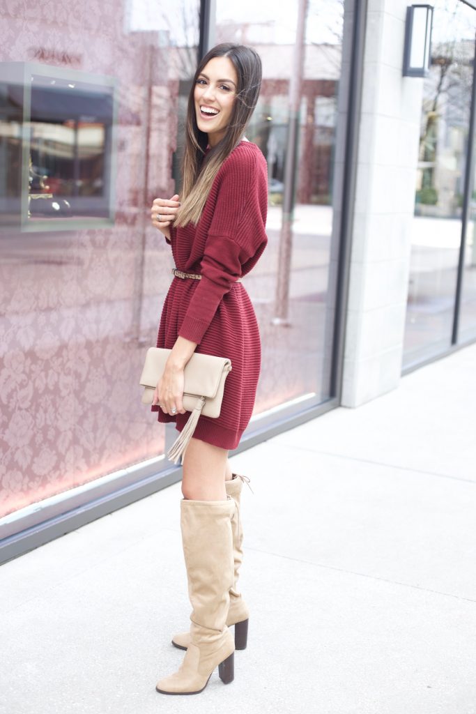 Wine-colored sweater dress paired with boots