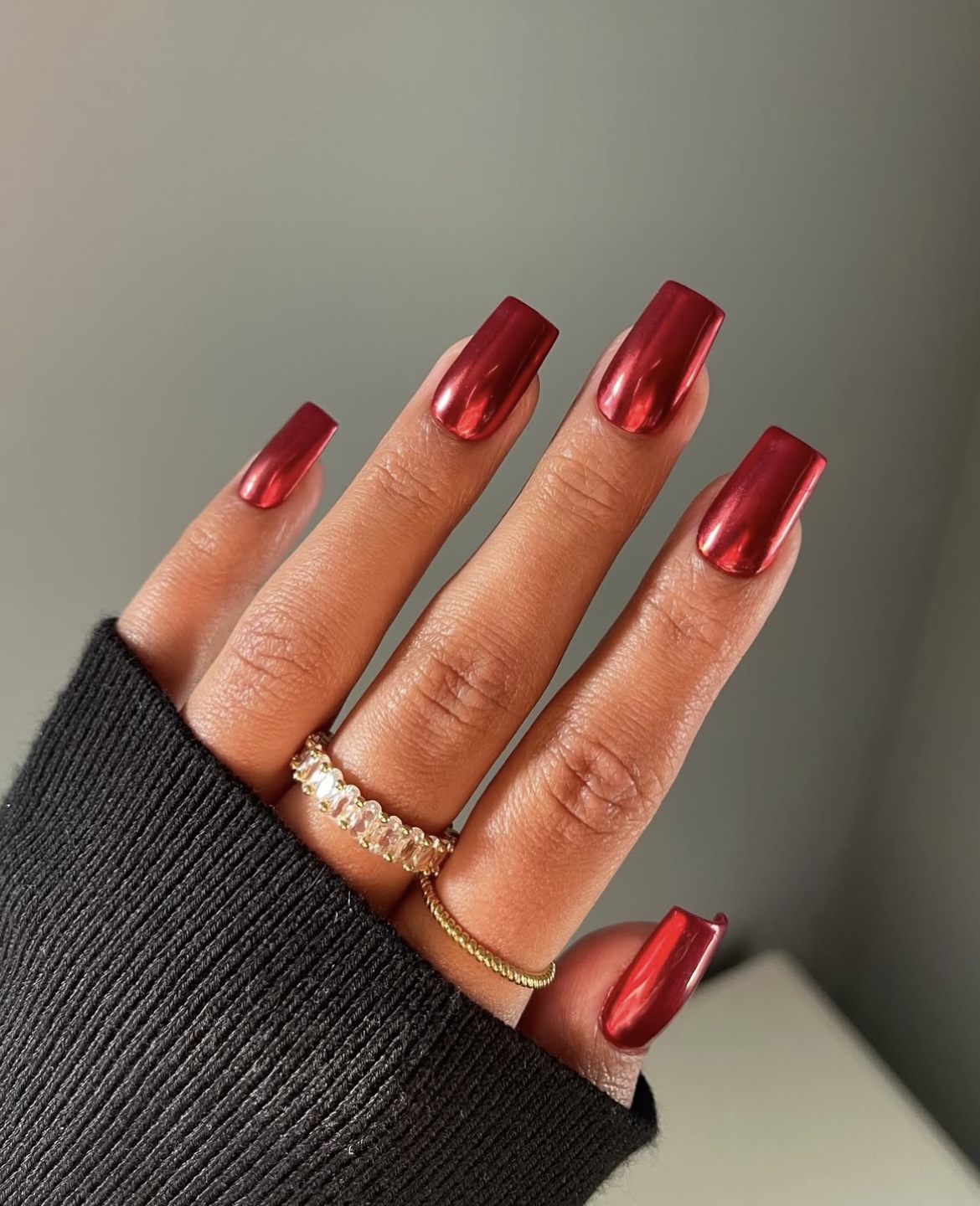 Red chrome mirror-finish nails on square-shaped nails