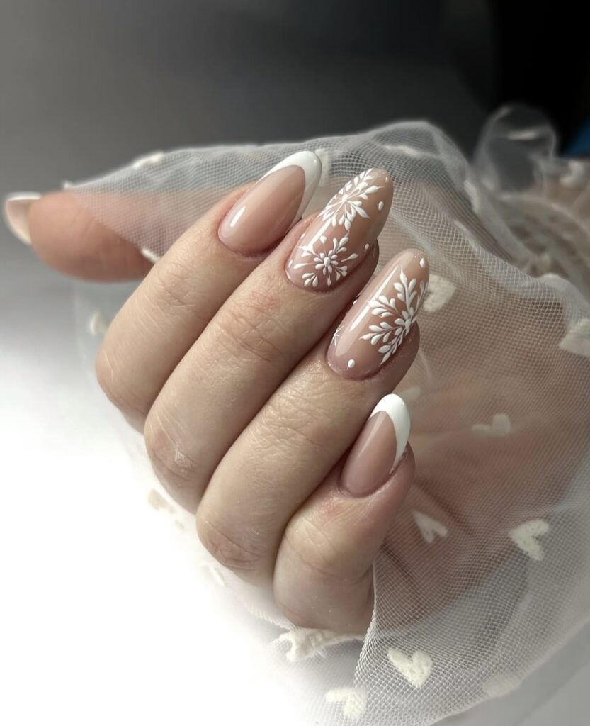 French tip nails with white snowflake art
