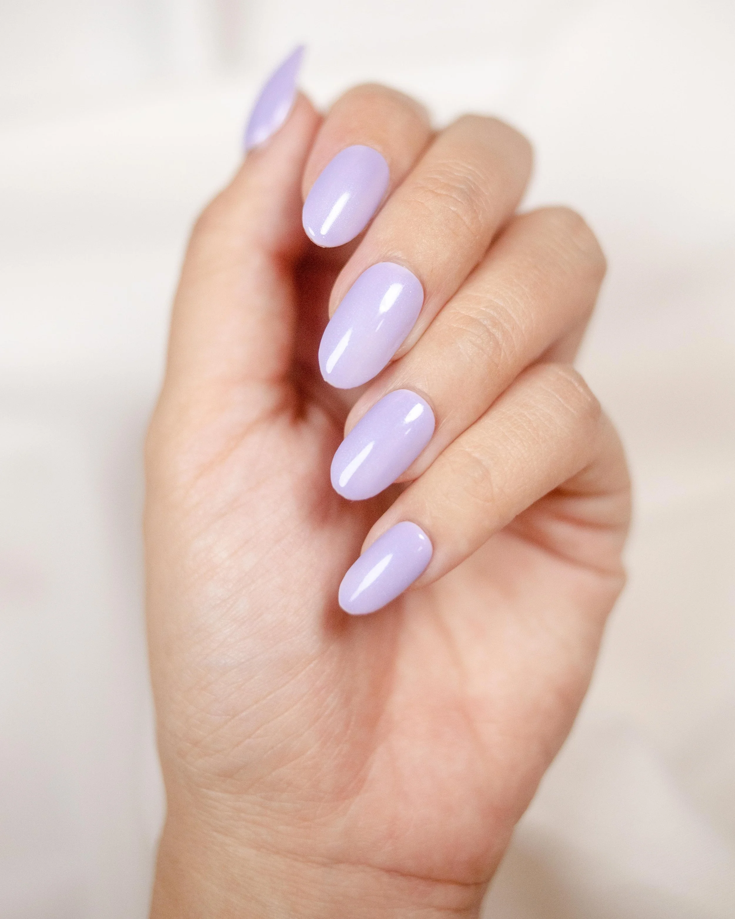 Icy Lilac: a pale lavender shimmer on short almond nails