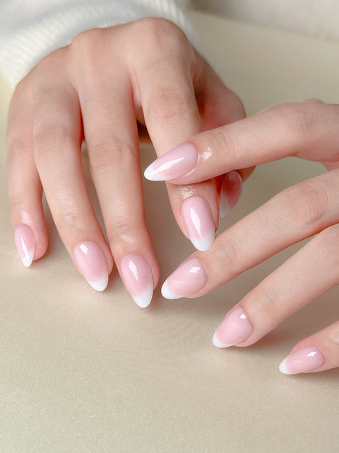 Nails with soft white gradient fading into nude tips