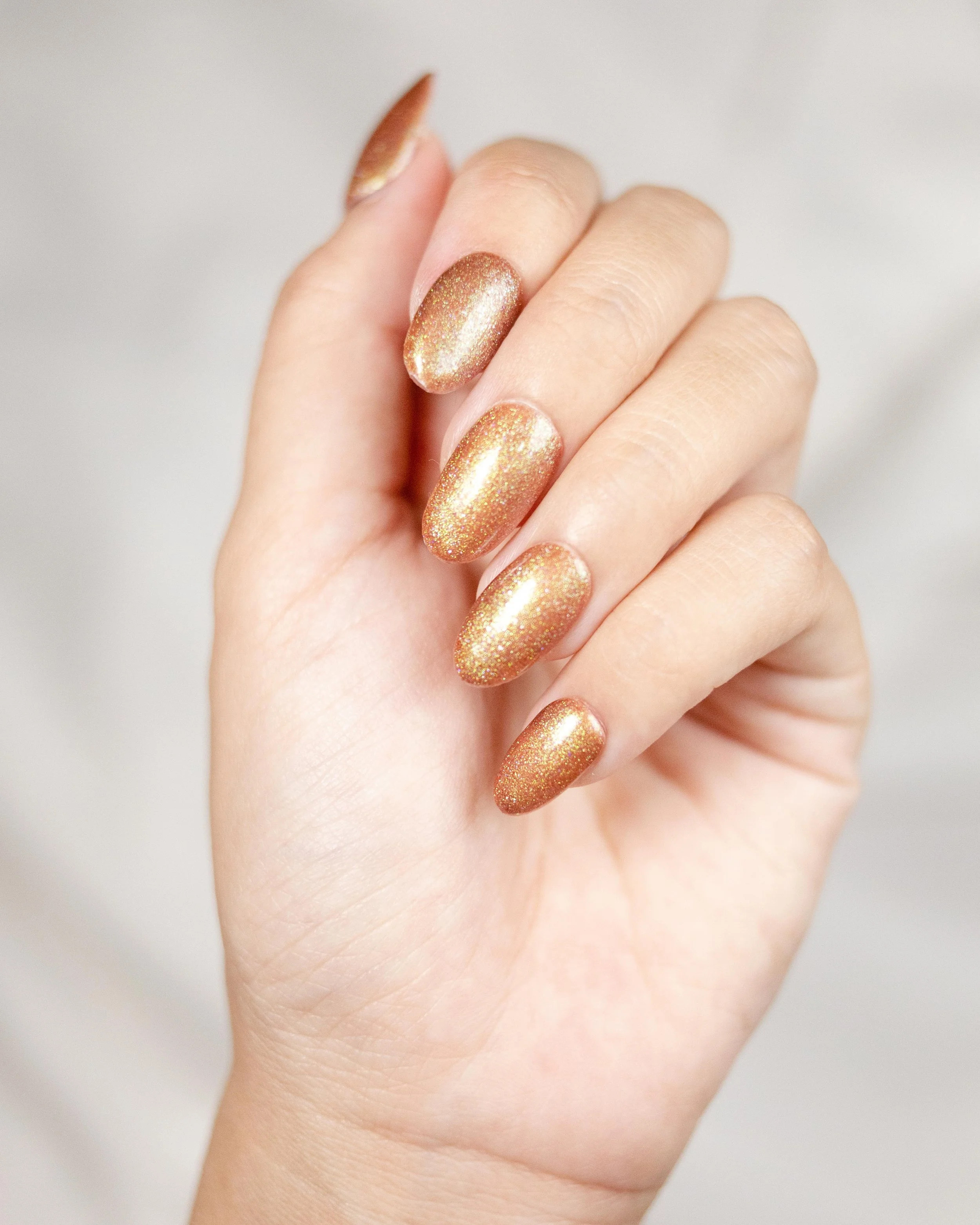 Burnished Copper: a copper shimmer on short almond nails