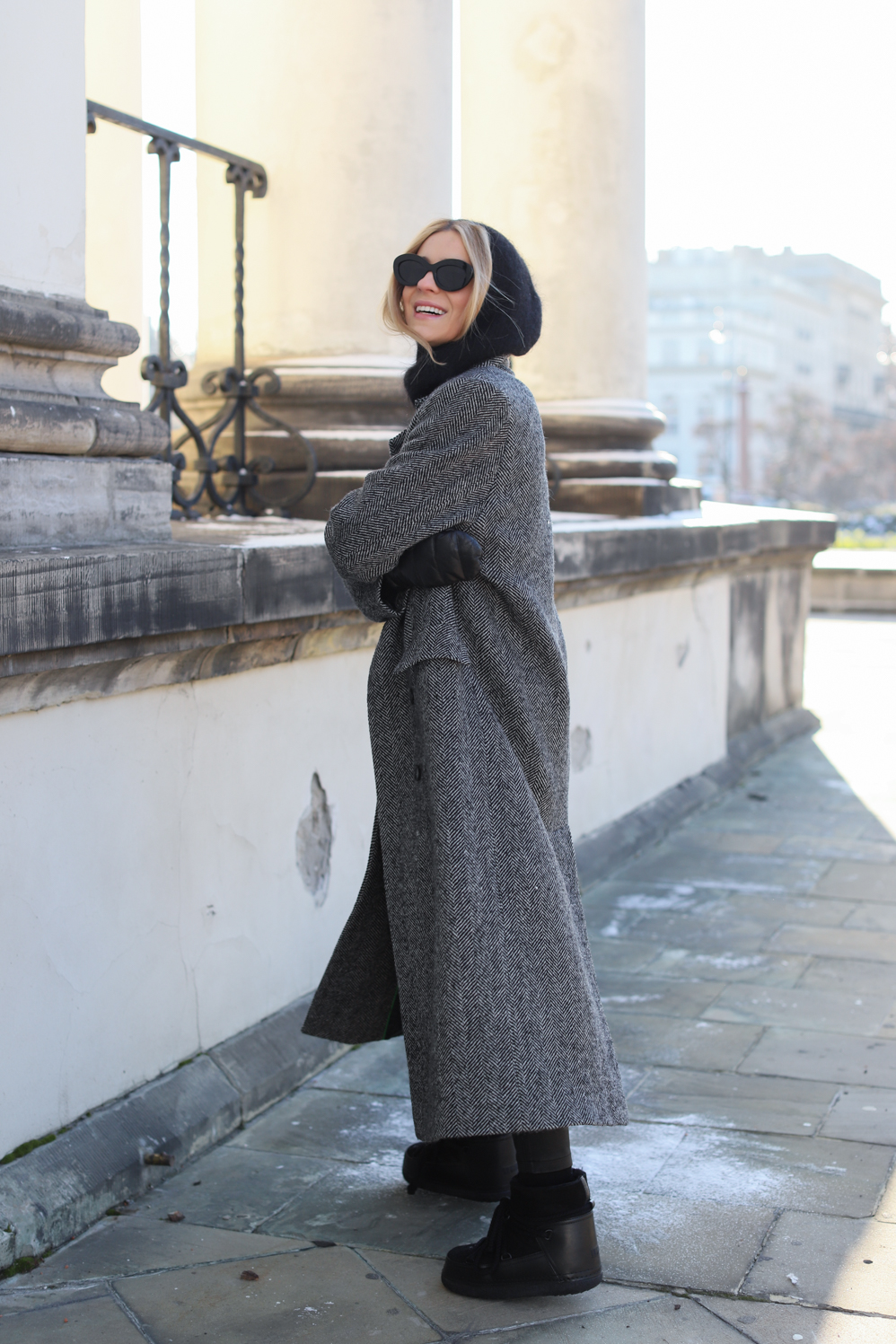 Woman wearing a herringbone coat in winter