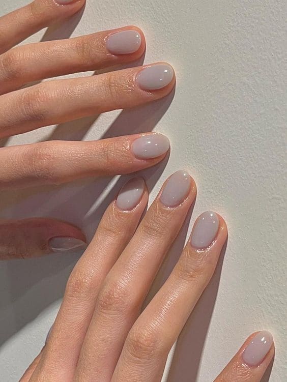 Short nails in a milky translucent cool gray jelly polish