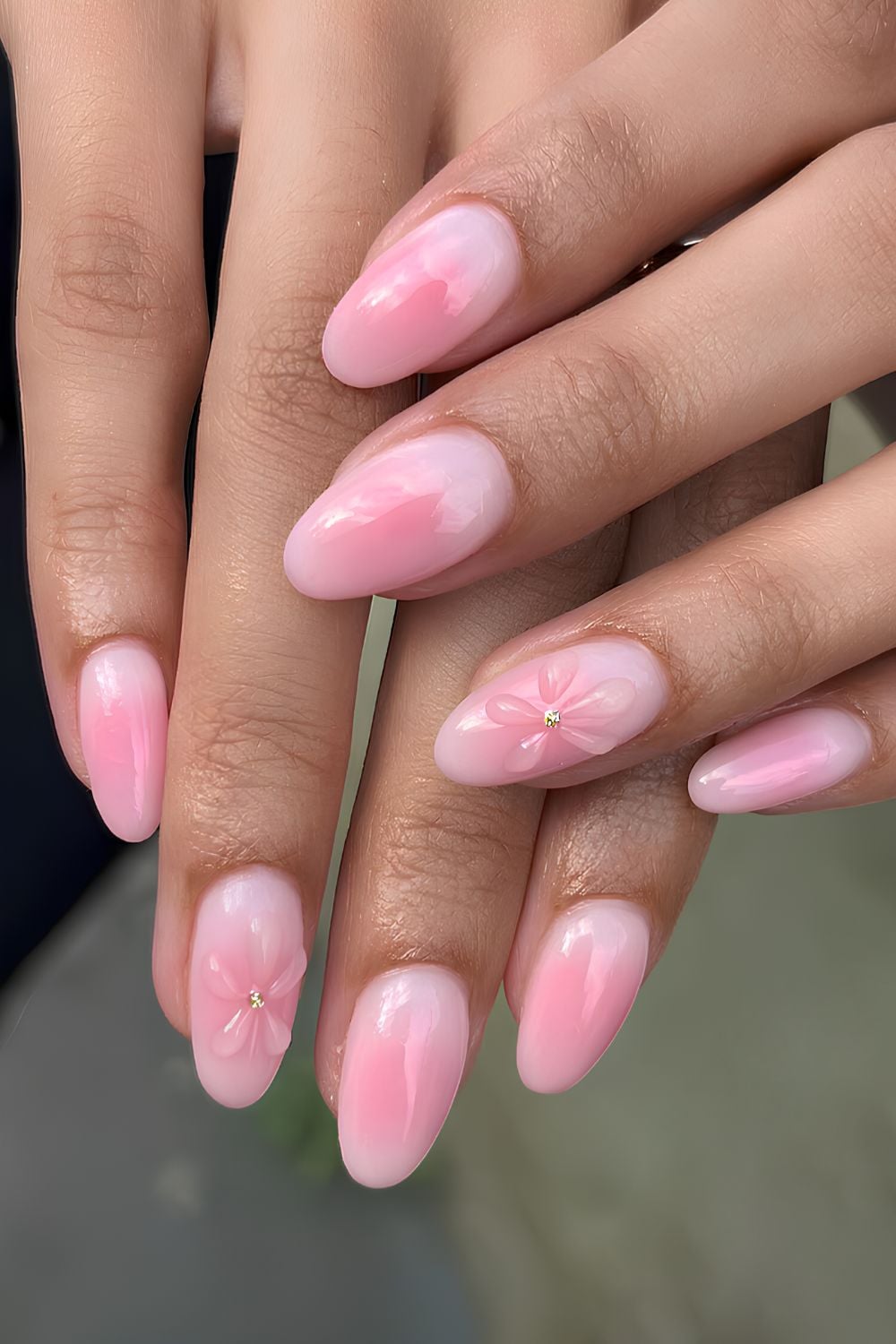 Light pink aura nails with textured flower details