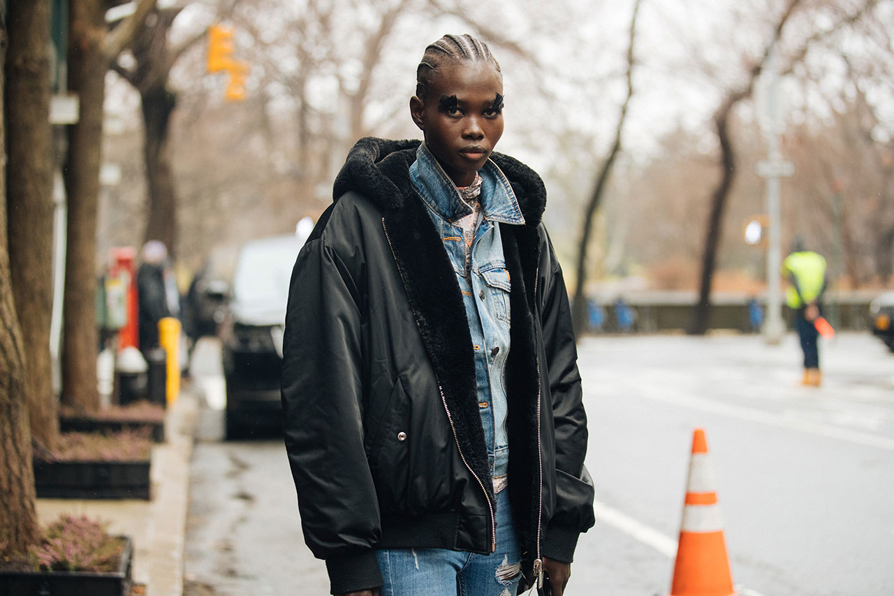 Woman wearing a shearling-lined denim jacket street style