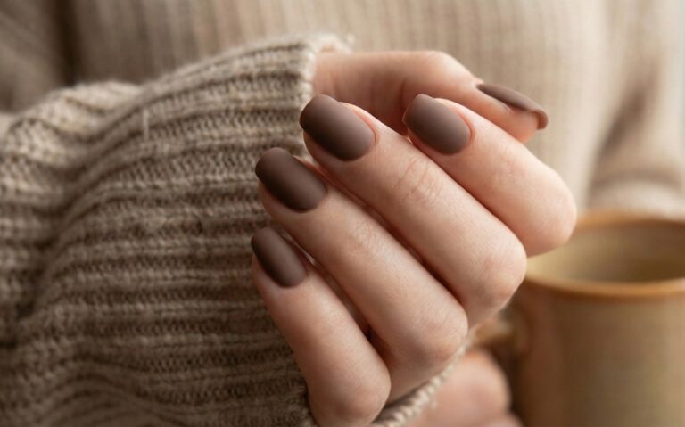 Almond nails in a solid matte cocoa-brown crème.