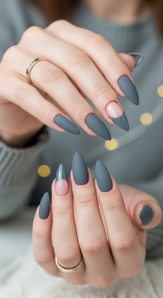 Matte gray almond nails with one glossy gray accent nail with a nude base