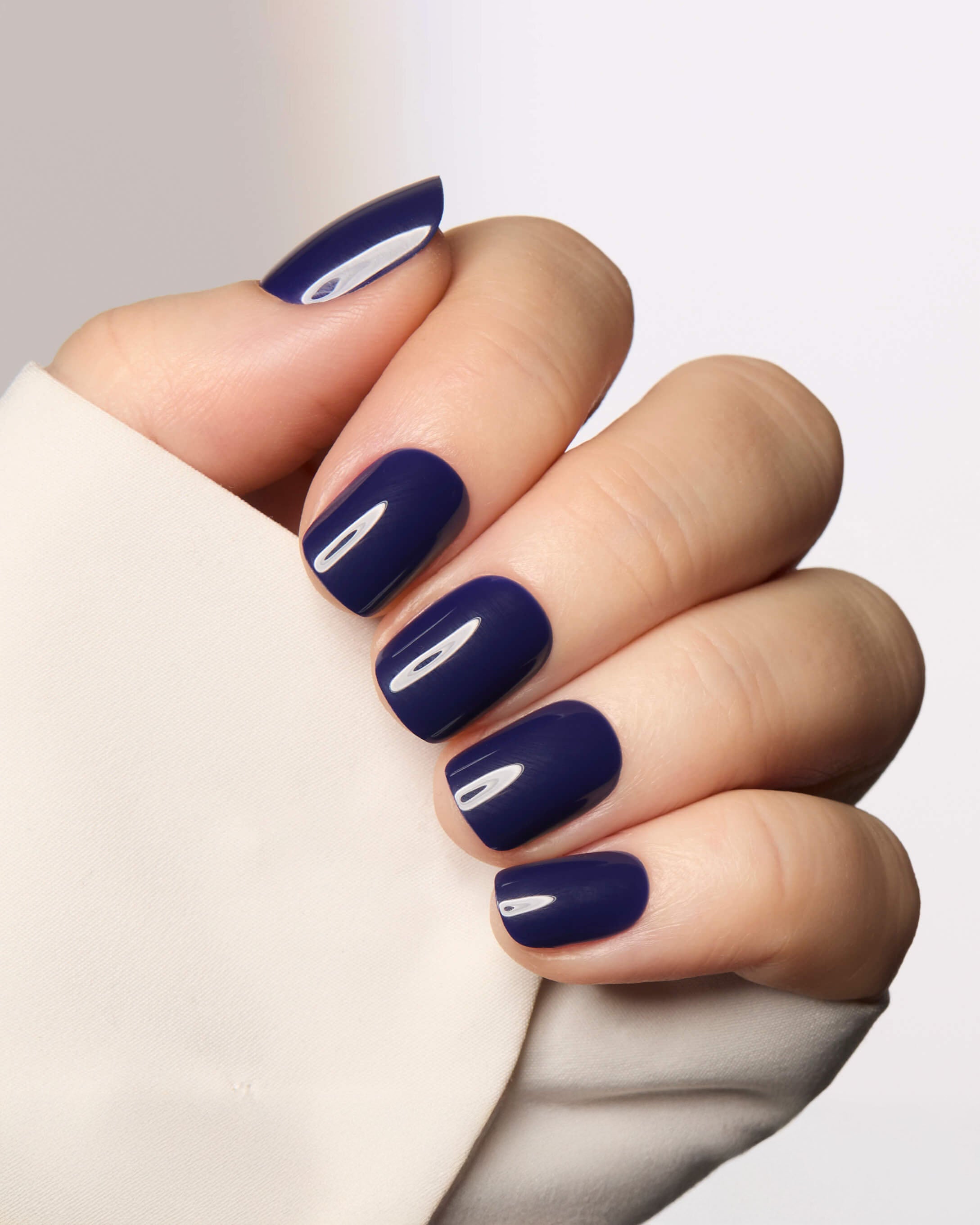 Short square nails in glossy midnight navy blue