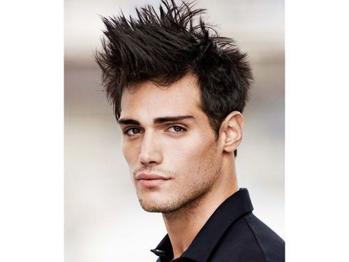 Tousled spiky textured hairstyle with short clean sides