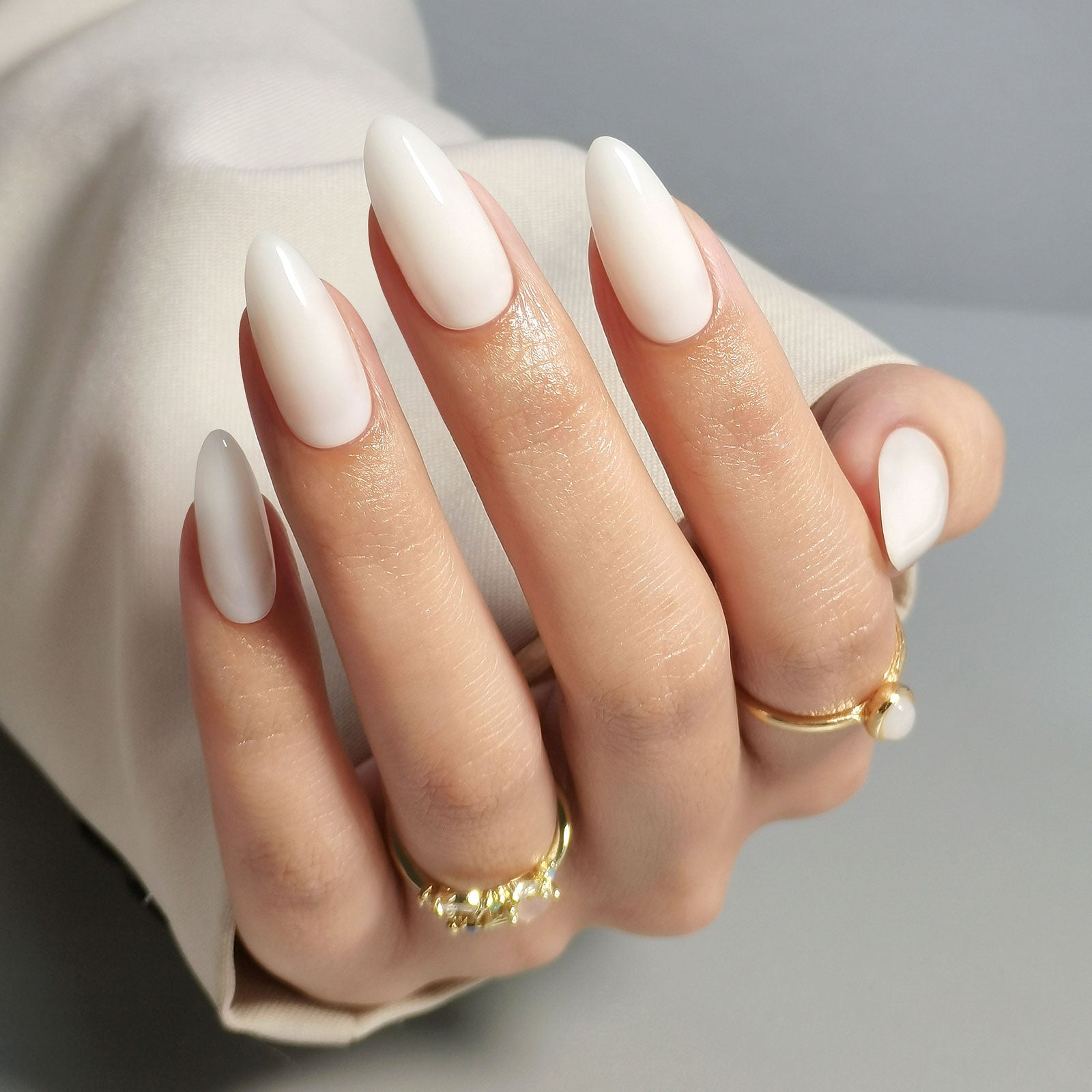 Short almond nails in milky nude opaque polish