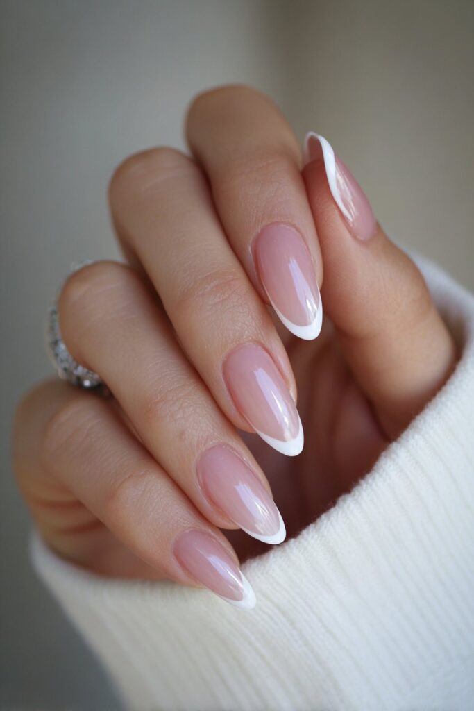 Almond nails with micro-thin white French tips