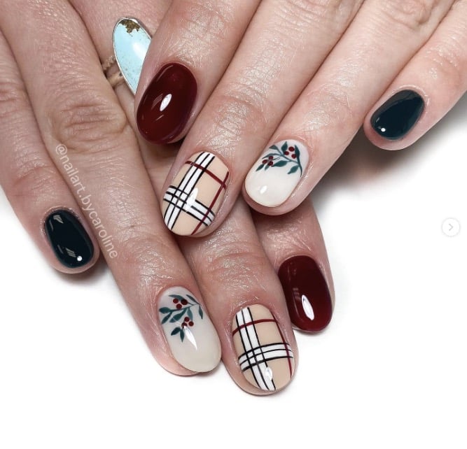 Burgundy and white nails with holly mistletoe sprigs and plaid check accents