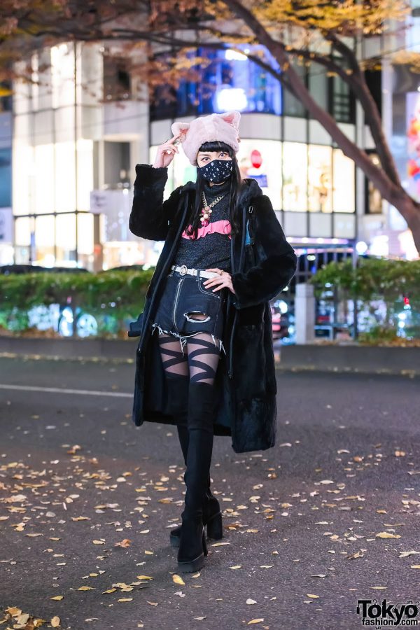 Harajuku street style with black over-the-knee boots and a fur coat