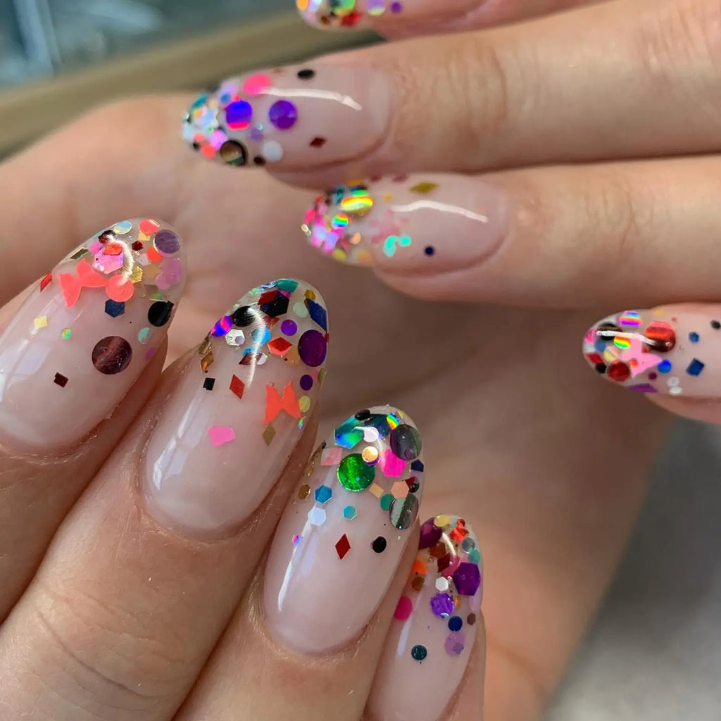Nude nails with multicolor confetti glitter topper