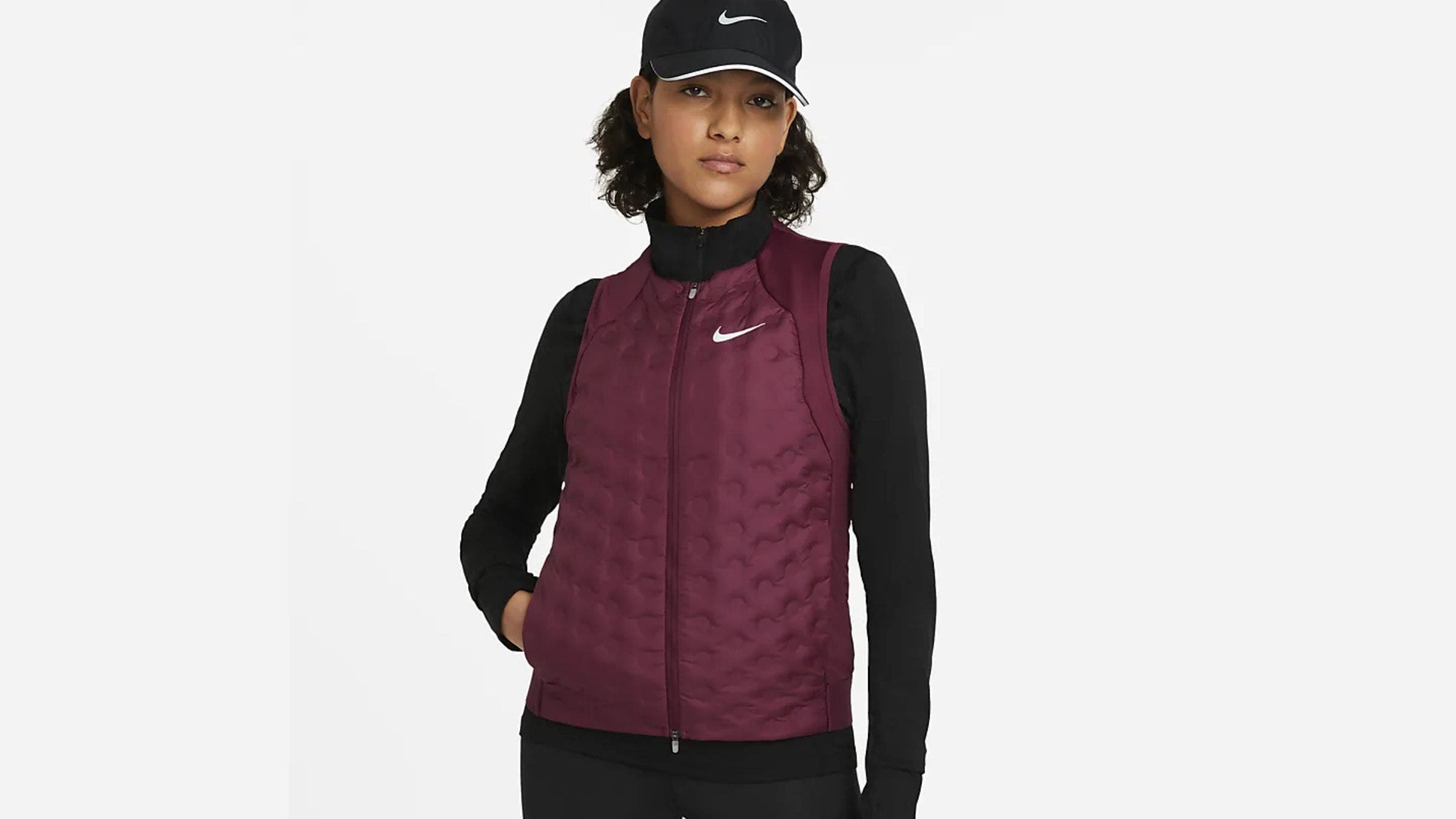 Woman wearing a windproof insulated running gilet vest
