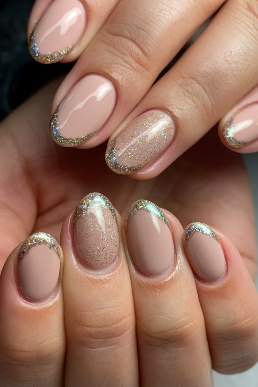Short almond taupe-nude nails with holographic sparkle