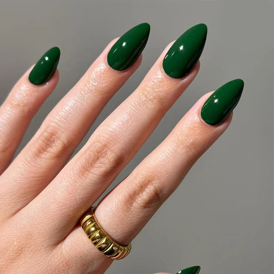 Long almond nails in glossy emerald green