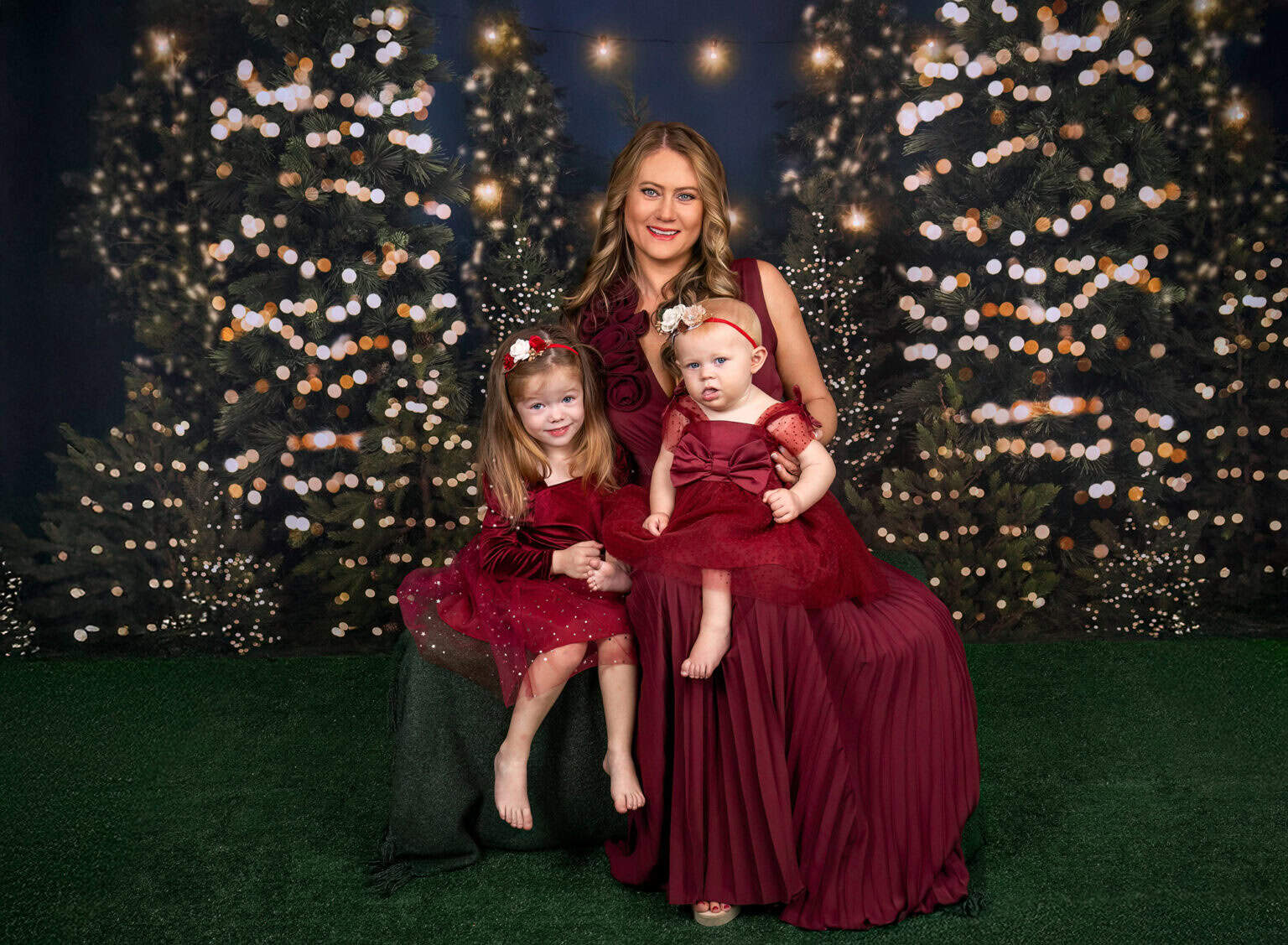 Family at a holiday mini photo session in festive dresses