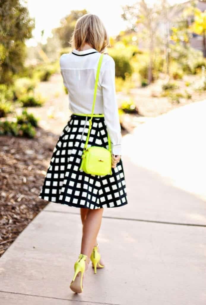 White shirt with a black windowpane plaid A-line skirt