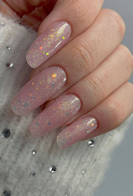 Almond nails with blush pink base and iridescent flakies