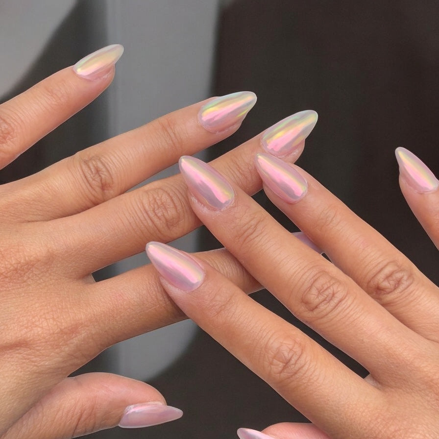 Almond nails with a pink iridescent chrome shimmer