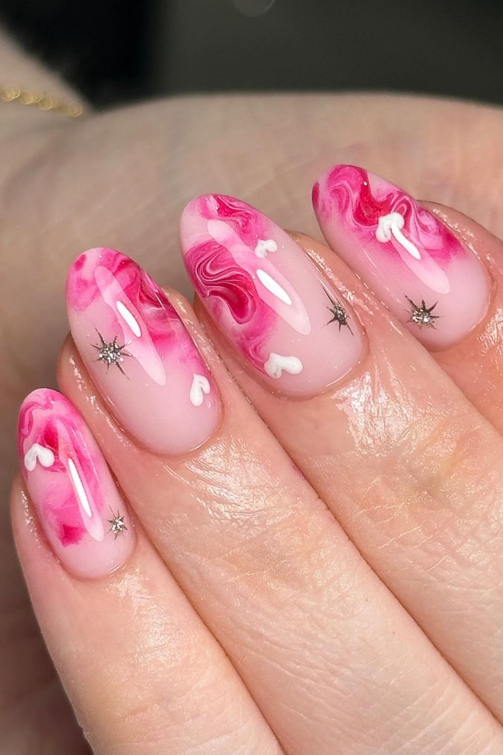 Pink marble swirl nail design
