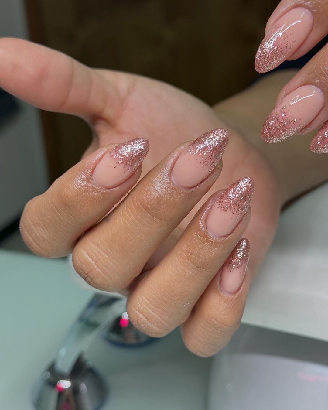 Rose gold glitter ombre nails on almond shape