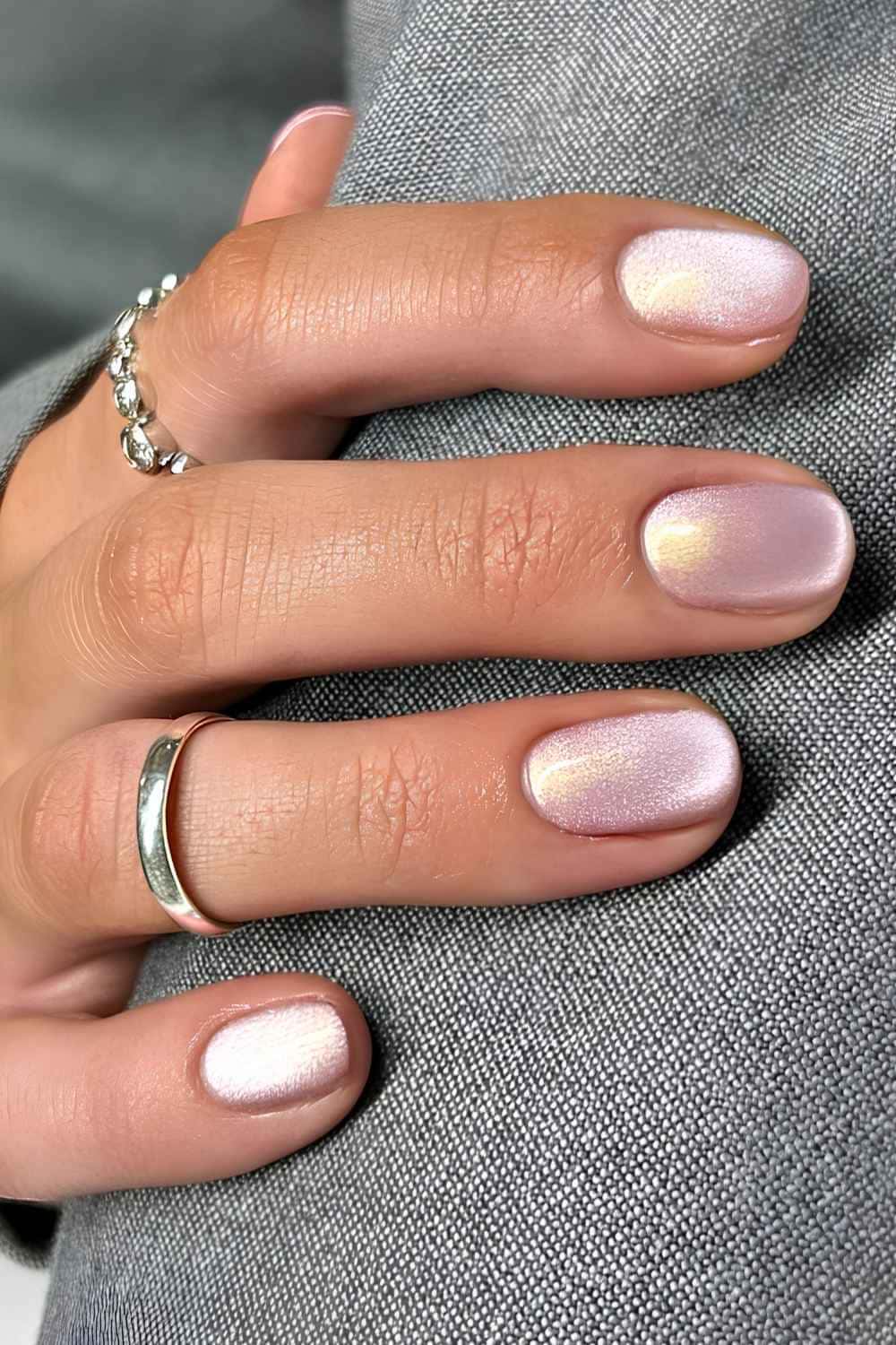 Short natural nails in a pink champagne velvet magnetic shimmer finish