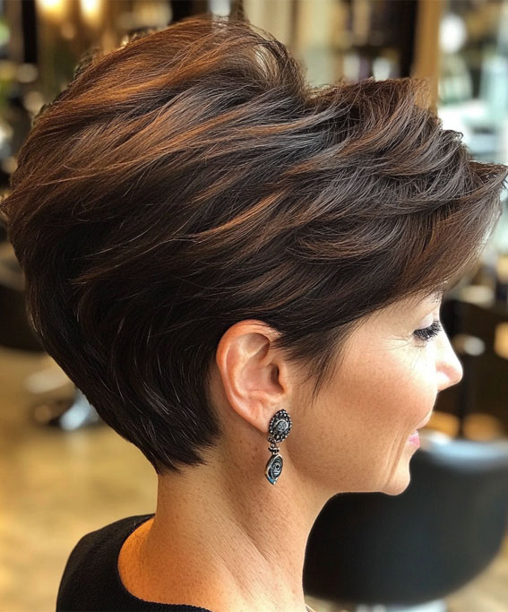 Dark brown tapered pixie cut on an older woman