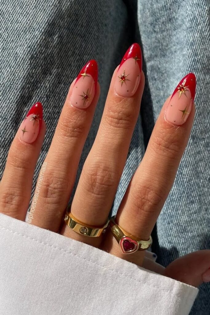 Burgundy nails with gold star nail art, long