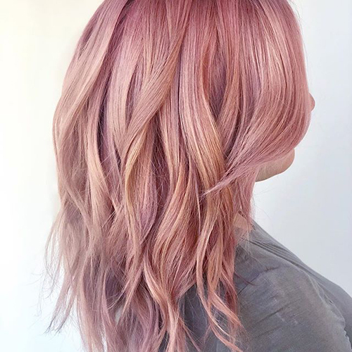 Rose gold hair color in long tousled waves
