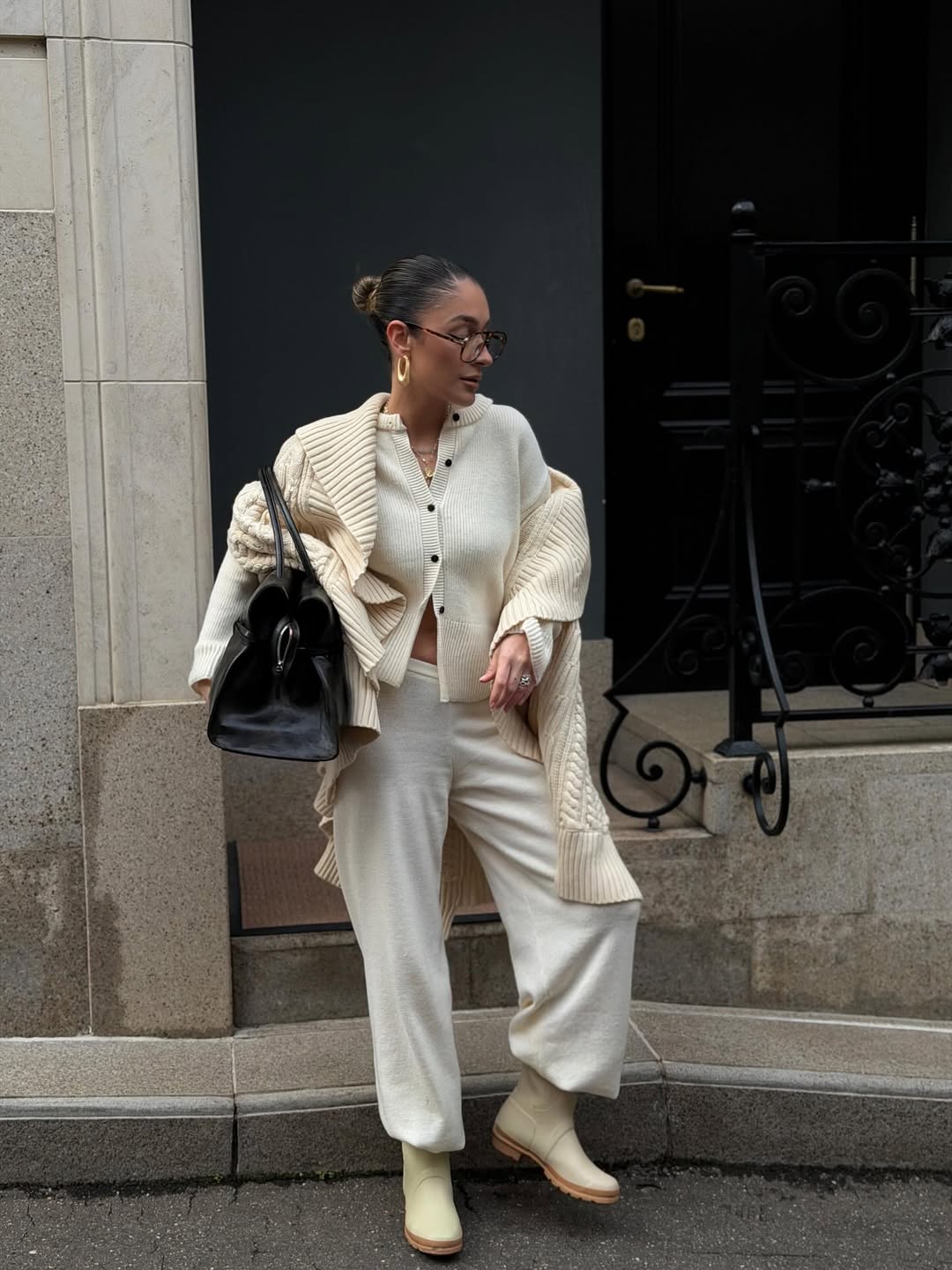 Woman in an all-cream knit outfit wearing cream mini ugg boots