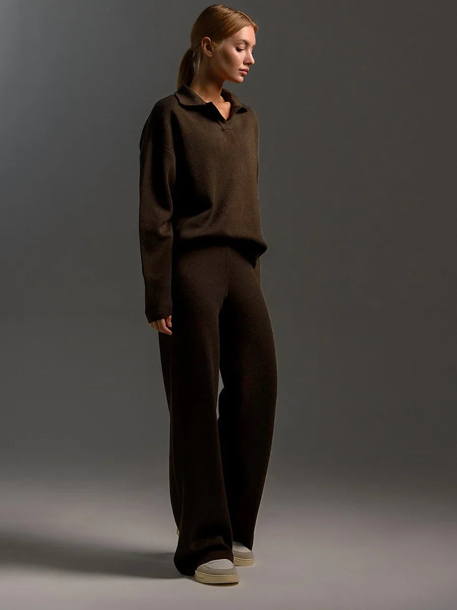 Woman wearing a dark chocolate brown collared knit pullover and matching wide-leg knit pants with light sneakers