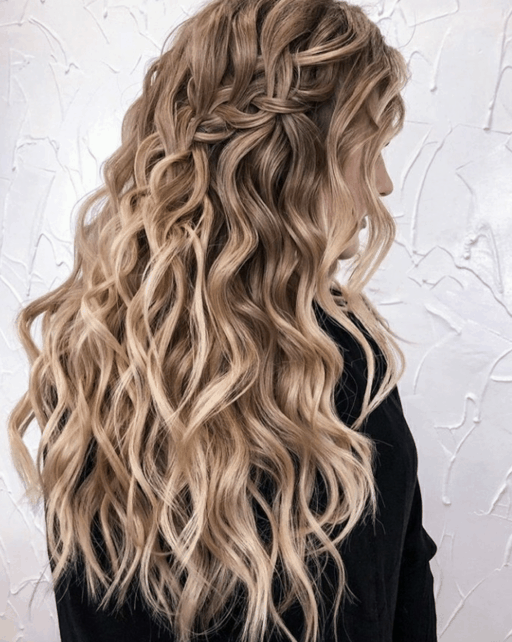 Tiny accent braids scattered through flowing wavy hair