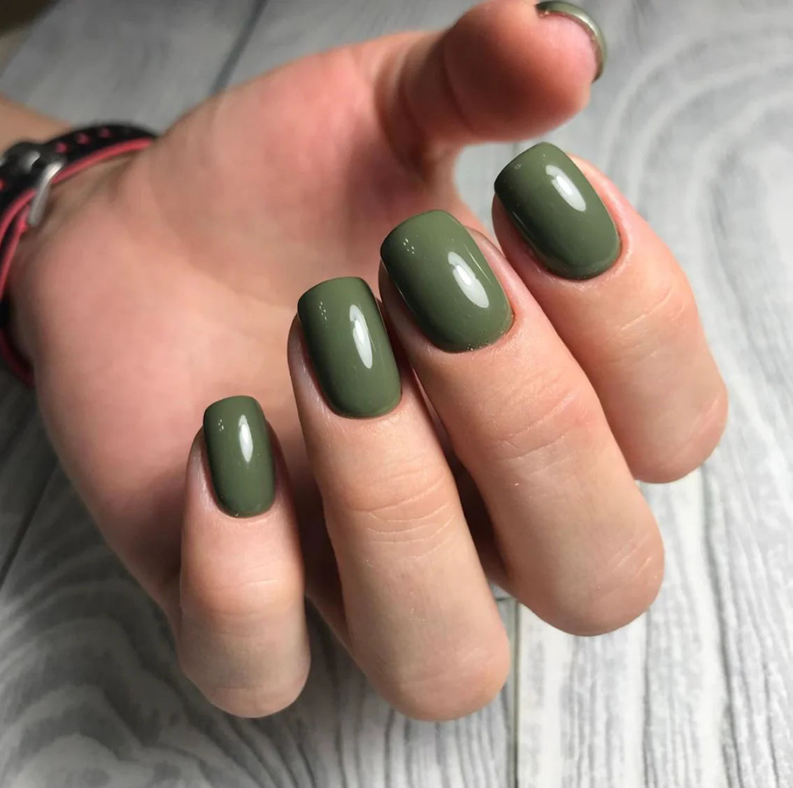 Short nails with olive green gel polish