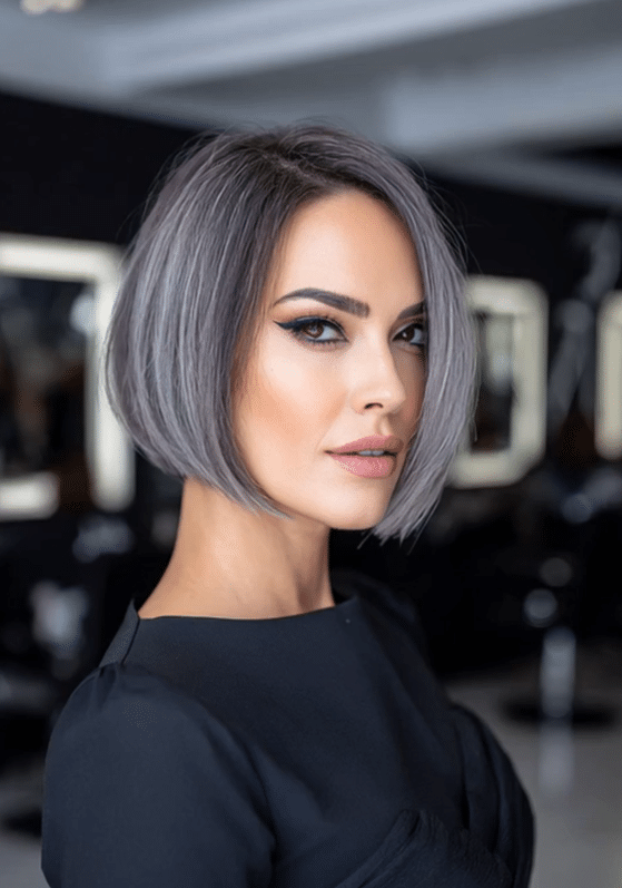 Sleek one length silver bob haircut with side part