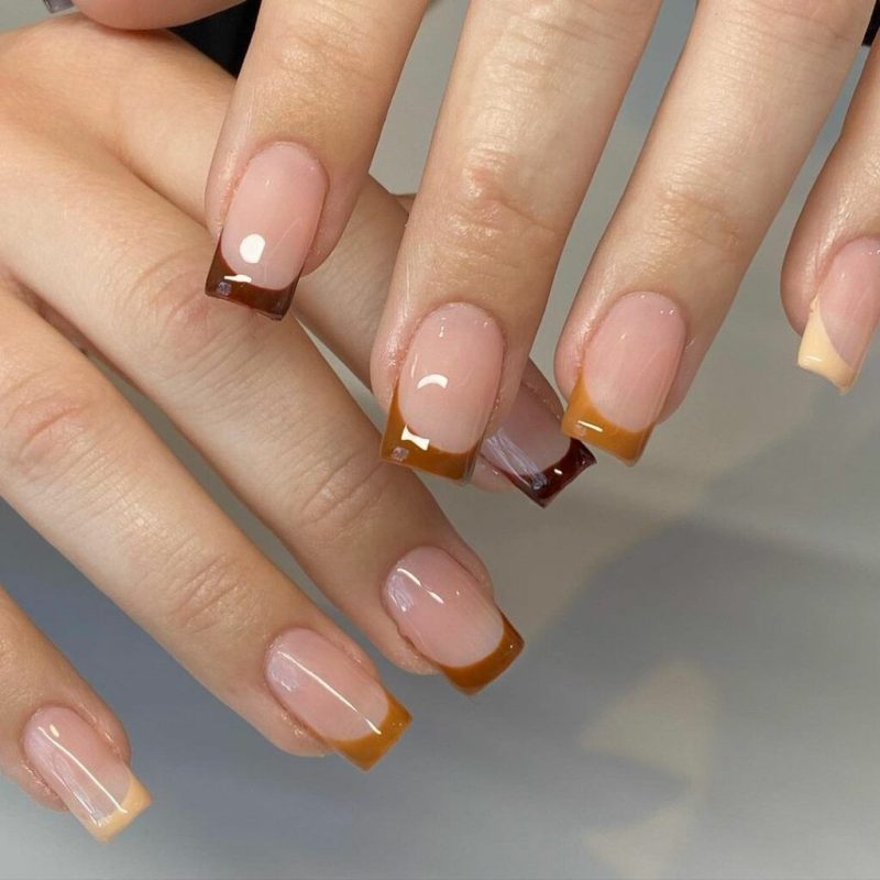 Short square nails with espresso brown French tips on a nude base