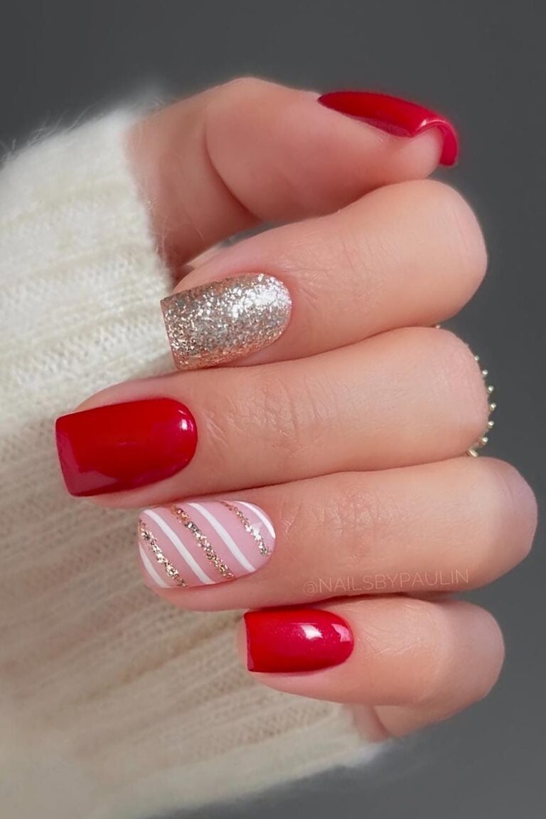 Short square red nails with a gold glitter accent nail and a striped accent nail