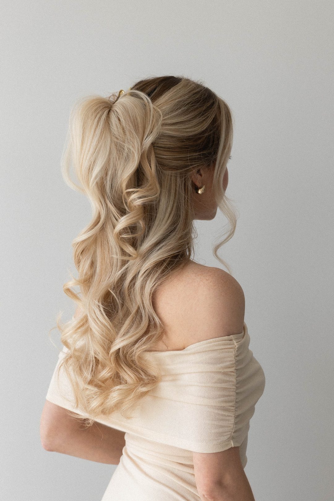 Claw clip twist hairstyle with loose wavy hair